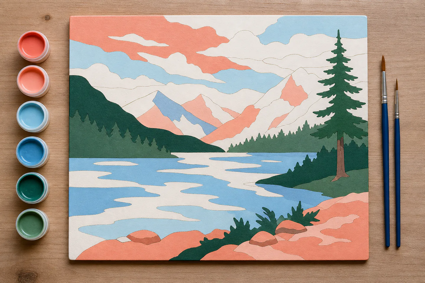 A partially completed stylised mountain-and-lake painting board beside small acrylic paint pots and two detail brushes